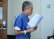 Lau Van Huynh leaves the courtroom after he's sentenced to three years of probation and 365 days in jail