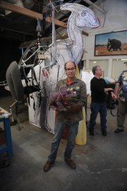 <b>DINO BROS:</b> Burbank-based brothers Stephen (above, holding baby triceratops) and Edward (standing next to Stephen) Chiodo are the visionaries behind Duncan the T. rex, Lilly the Parasaurolophus, and a to-be-named baby Triceratops, the latter two of which make their debut at the Santa Barbara Zoo on May 10.