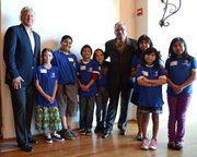 Randy Weiss and Cam Sanchez with Goleta and Westside Boys and Girls Clubs kids during annual community breakfast.