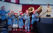 Zach Schmidt as Harold Hill conducting the River City Boys Band in Lompoc Youth Theater's 2012 production of The Music Man.