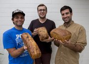 Genuine Bread Co.’s Geoff Jensen (left to right), Andrew Elia and Jeff Appareti outside of the French Press where they sell their loaves every Tuesday and Saturday.