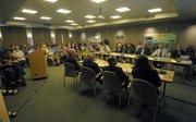 More than 100 people showed up last at Wednesday's emergency meeting, and an overflow room opened up. The discussion was long on specifics about possible cuts, but much shorter about the search for other funding sources or the pursuit of legislative remedies.