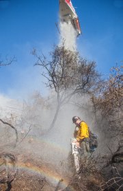 Cold Fire--lead sawyer gets hit from a water drop called in to cool down a hot spot.