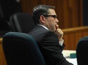 Prosecutor Brian Cota listens to the Flores's defense attorney's argument for probation.