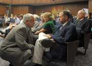 Santa Barbara County Housing Authority CEO Robert Pearson (left) talks with Casa Esperanza executive director Mike Foley at the Board of Supervisors (Sept. 17, 2013)