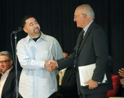 <b>HELPING AND HEALING:</b> Gulf War vet Steven Lopez (left) provided Judge Eskin (right) the lightbulb moment about the need for a veterans court many years ago. Last week, Eskin got to congratulate Lopez for graduating following a year of sobriety and treatment.