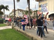 <b>HERE AND HEARD:</b> Chanting “No Justice, No Peace” and “S-BP-D, no police brutality,” about 60 anti-gang-injunction activists affiliated with PODER marched down State Street and into the City Council pews.
