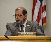 Roger Aceves, board member of the Santa Barbara County Association of Governments, listens during the meeting about the Highway 101 widening project.