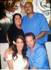 Mr. and Mrs. Jesse James Hollywood on their wedding day (front) accompanied by the maid of honor and best man