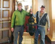 Tom Houghtaling and Michael Junk hold the Arlington lamp that went missing Christams Eve 2011 and was found at a yard sale.