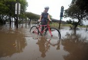 It takes more than a flooded bike path to keep UCSB physics grad student Katharine Hyatt from going to class.