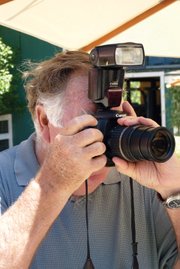 <b>PERMA-LENS:</b> This is usually what winecountry photographer Bob Dickey looks like at the various events around the region.