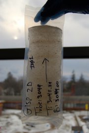 A core sample from 3,000 meters (9,800 feet) deep in Greenland's Ice Sheet shows sand and silt.