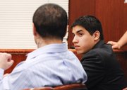 Raymond Daniel Macias, left, looks toward his co-defendant Luis Alfredo Almanza. (June 20, 2014)