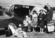 George Hammond (1897-1982), pictured here with his wife and the Lester family, established an airfield on the island and regularly shuttled mail and supplies to and from the mainland