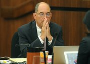 <b>LOOKING AT LIABILITY:</b> County Counsel Mike Ghizzoni took questions and comments from the supervisors, oil industry officials, and environmentalists about Measure P’s legal risks.