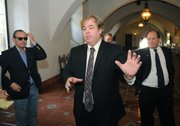 Left to right: Journalist Peter Lance, attorney Donald Bartlett, attorney Michael Fremont (background), and Darryl Genis talk to reporters after Judge Donna Geck dismissed the contempt of court case against Genis. (Aug. 1, 2014)