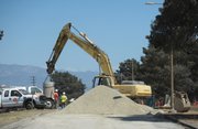 Mesa Road is closed while workers finish installing the pipeline underneath the pavement.