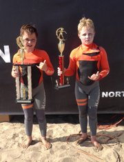 Twin brothers Hamilton, left, and Curtis Jacobs show off the hardware they won at the NSSA Gold Coast Conference meet at C Street in Ventura.