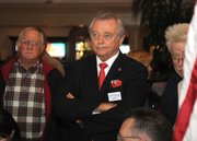 Congressional candidate Chris Mitchum watches for the next round of polling results on election night (Nov. 4, 2014)