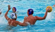 San Marcos’ Jesse Morrison (8) is weighted down by Santa Barbara defender Peter Beeson (3).