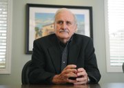 <b>RAISING THE BAR: </b> UCSB trustee and professor emeritus Duncan Mellichamp says students of the world-class university should be held to a higher standard. Above is a typical day of biking and boozing in the next-door college town of Isla Vista.