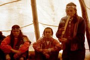 American Indian Movement leaders Dennis Banks (left) and Russell Means, seated, with Lakota medicine man Wallace Black Elk — from <em>Wounded Knee: A Line in the Sand</em>, a Kevin McKiernan film currently in post-production.