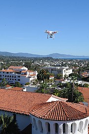 <b>ANYWHERE AND EVERYWHERE:</b> A Phantom drone hovers over the courthouse as its pilot uses his iPhone to take pictures and video with the on-board camera.