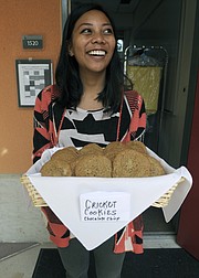 Bren School student Jennifer Sajor gets ready to pass out "Chocolate Chirp" cricket cookies.