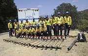 Santa Barbara County Fire Department's wildland firefighters pose for a photo after clearing vegetation along Stagecoach Road. (May 6, 2015) ...