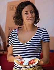<b>SERVICE WITH SMILE:</b> A volunteer for Pacific Crêpes serves up a sweet version at last year's French Festival in Oak Park.