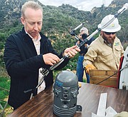 <b>SMELL TEST:</b> FlameSniffer CEO Cam McKenna (left) and Southern California Edison crews install FlameSniffer sensors in Mission Canyon.