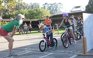 Students at Vieja Valley school's Bici Familia practice looking both ways before pedaling.
