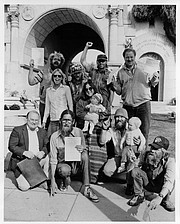 Ed Mannon (upper left) celebrating the legal victory waged by the Legal Defense Center giving homeless people the right to vote even though they lacked a legal domicile.