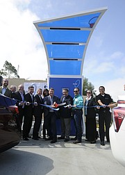 Dignitaries cut the ribbon Friday at the Central Coast's first electric-car charging station, located at La Cumbre's Conserv Fuel.