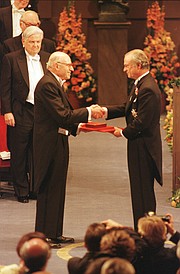 Accepting his 1998 Nobel Prize in chemistry from King Carl XVI Gustaf of Sweden.