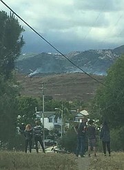 El Encanto Heights neighbors spy smoke from a half-acre grass fire that broke out Tuesday evening behind Glen Annie Golf Club.