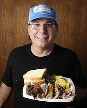 Texas Rex shows of his plate of Apple-Hickory Pork; Pecan wood Brisket; SautŽed green bean with bacon; Cheesy squash; Peach cobbler for the Santa Barbara Independent's 7th Annual Sizzling Summer BBQ Contest