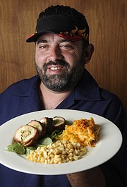 Tony Figueroa shows off his plate of Bacon wrapped chicken breast stuffed with pesto. Asparagus and homemade Hungarian sausage; with Mexican style corn with mayonnaise , chili, parmesan, lemon and butter on grilled corn cut off the cob; and macaroni and cheese with homemade Hungarian sausage and Cheez-It crumb topping for the Santa Barbara Independent's 7th Annual Sizzling Summer BBQ Contest