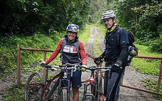 Rebecca Rusch and Patrick Sweeney rest after completing their extraordinary ride up Mt. Kilimanjaro.