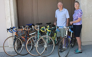 Wilson and Gail Hubbell pose alongside a few of their favorite bikes.