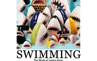 MOUTHFULS OF ART: Sharks of all colors and sizes cover the walls at Breakfast Culture Club, where Lorien Stern's ceramic carnivores commingle with coffee drinkers.