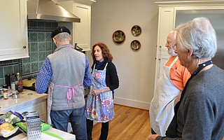 A bakery owner turned cooking teacher, Laurie Zalk breaks down the mystery of perfectly prepared chicken and rice with veggies to one of her students at a recent Men Only class, just one of the at-home culinary courses she offers.