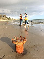 A survey team led by the State Lands Commission inspects Summerland Beach, where recent storms have uncovered historic oil wellheads.