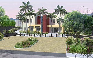 The entryway to Cortona Corner and its 176 units features a clubhouse building.