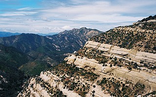 The white sandstone and high peaks of Hurricane Deck.
