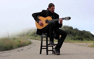 Chris Fossek, seen here along East Camino Cielo, puts his own Santa Barbaran stamp on Spanish guitar stylings.