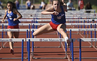 San Marcos hurdler Allie Jones (above, foreground) and 800-meter standout Erica Schroeder (below) set new records at the Santa Barbara County Championships.