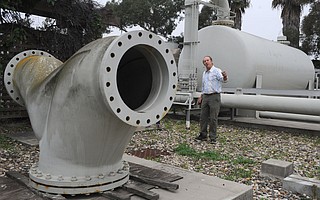 Robert Roebuck, a project manager with the city’s Public Works Department, leads a tour of the dormant desal plant in February 2014.