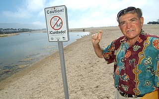 Tony Romasanta, pictured here in 2004, found himself at the center of the dispute over containing Mission Creek, which emptied into the ocean by Romasanta’s beachfront hotel.